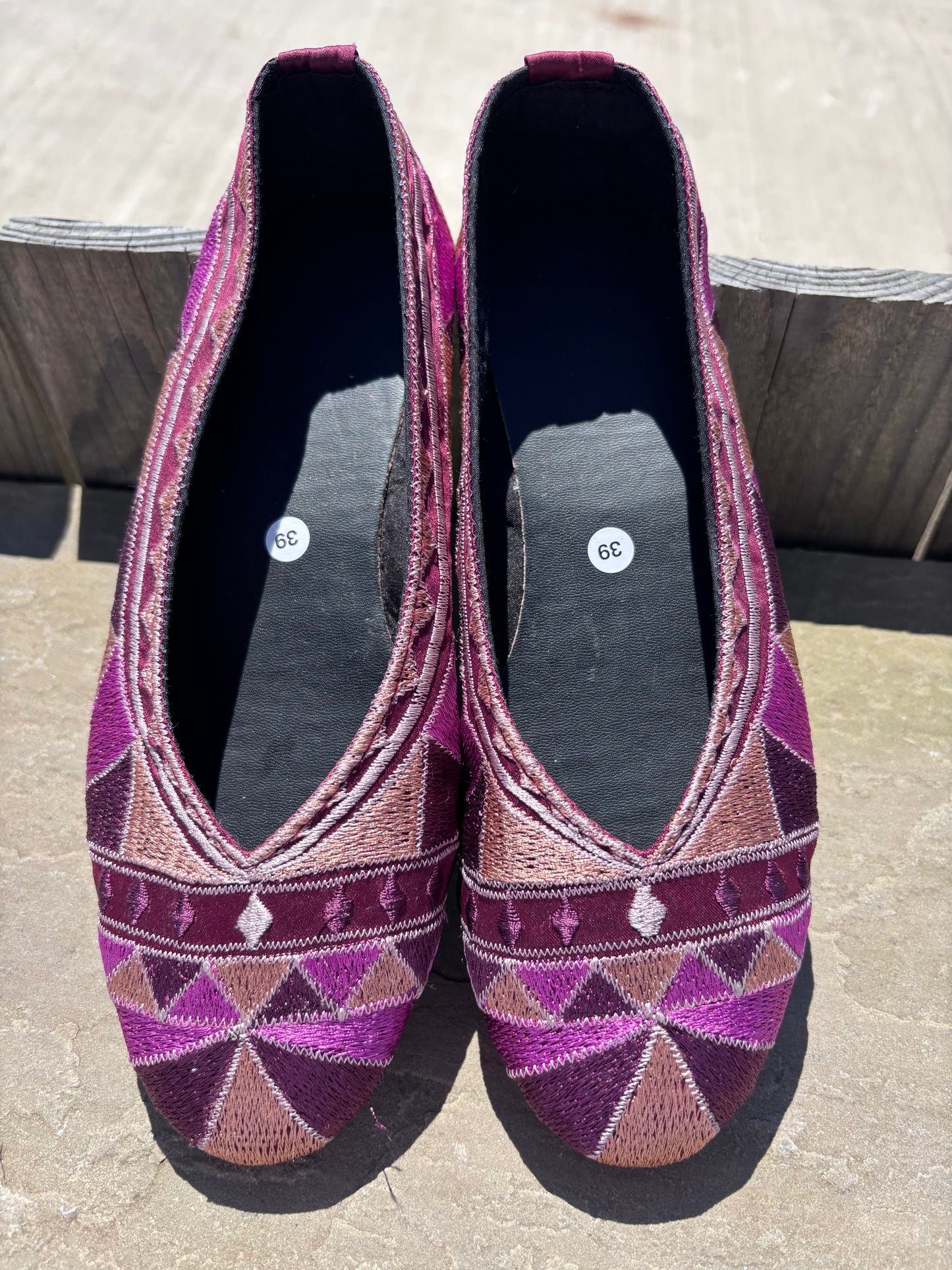 Embroidered  ballet pumps with a rubber sole.
